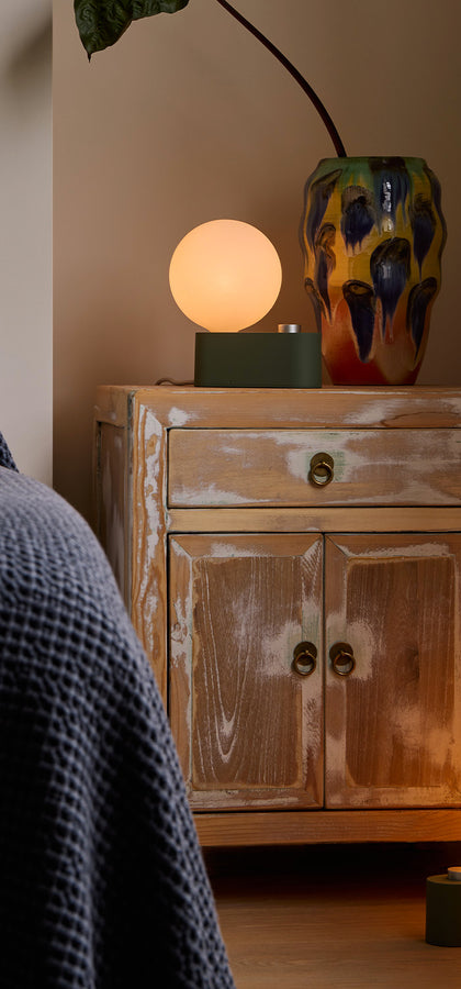 A set of two Alumina Multi-Use Lamps in Sage Green, perfect for any desk or bedside setting. Alumina has dim-to-warm technology to make it suit any space.