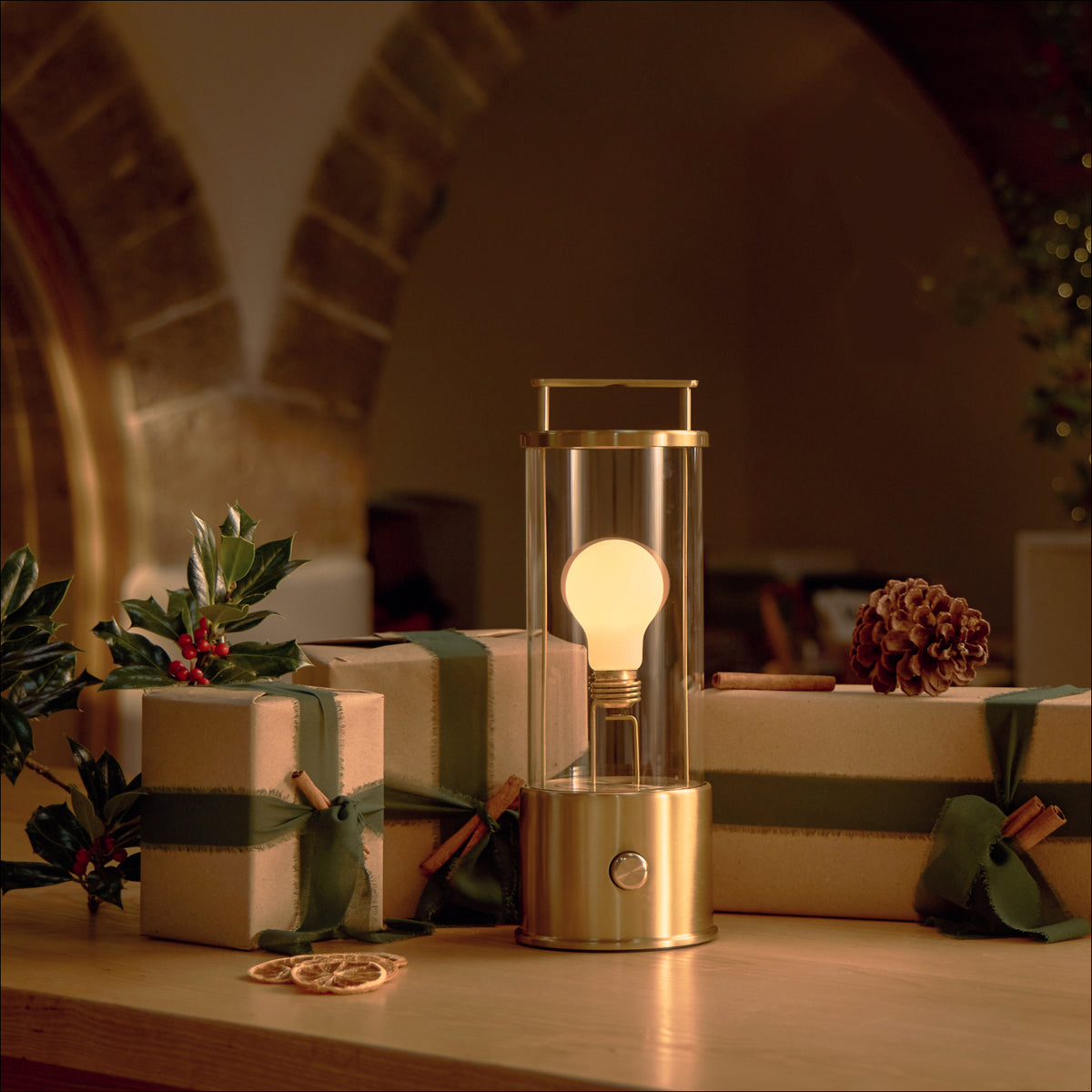 Tala's Solid Brass Muse product shot in a gifting setting. The Muse in Solid Brass is the perfect gift for someone who has it all. Explore our full 2025 lighting gift guide.