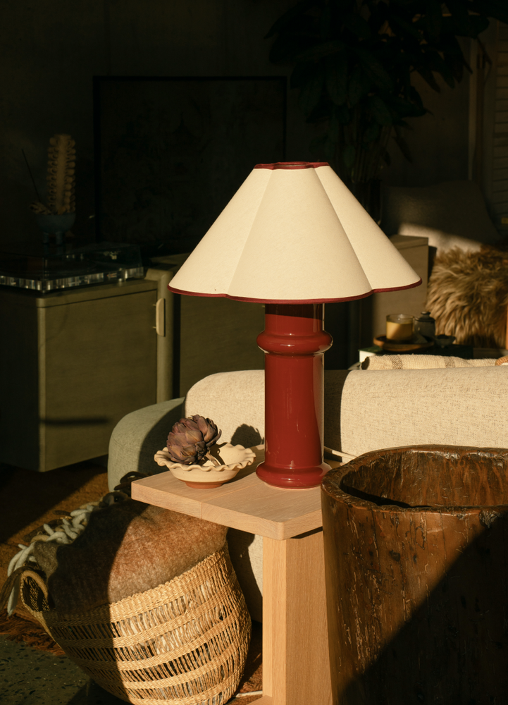heath table lamp next to boutique bed on a side table