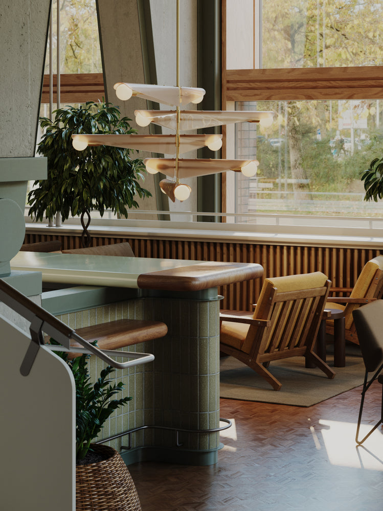 Inspired by nature, the Sycamore Chandelier is available in three or 5 tiers. Here, it lights up a dining room setting to make a statement with timeless lighting.