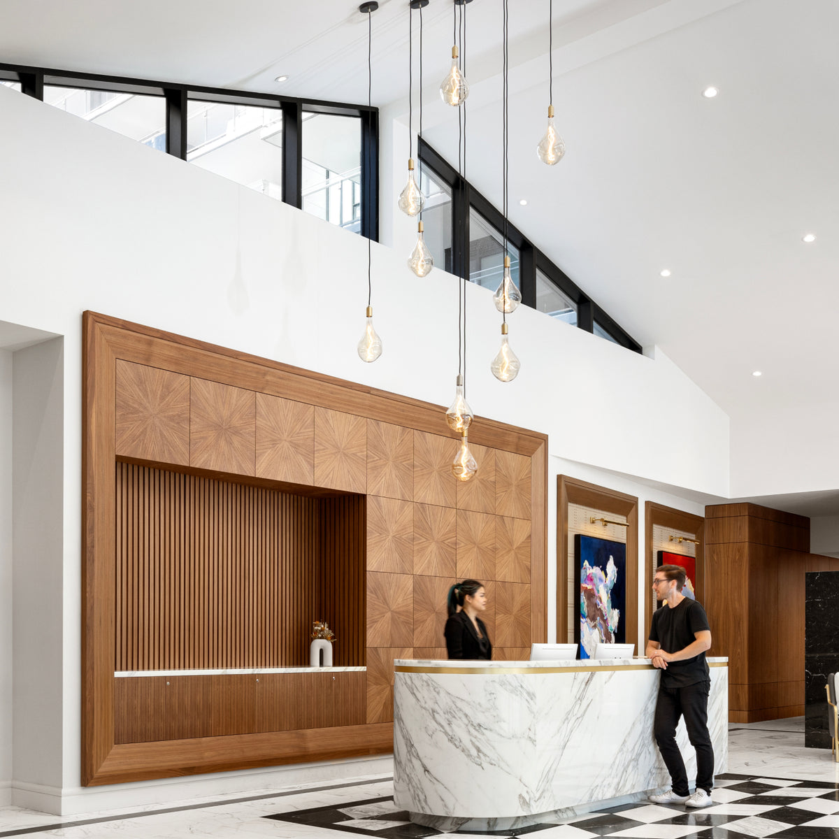 Lifestyle of Tala Voronoi Pendants illuminating professional workplace. 