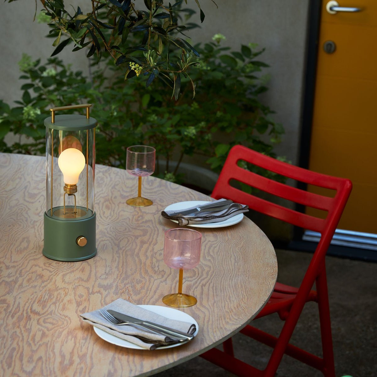 Lifestyle photo of Tala Muse Portable Lamp in Pleasure Garden Green, adding color and style to any space.